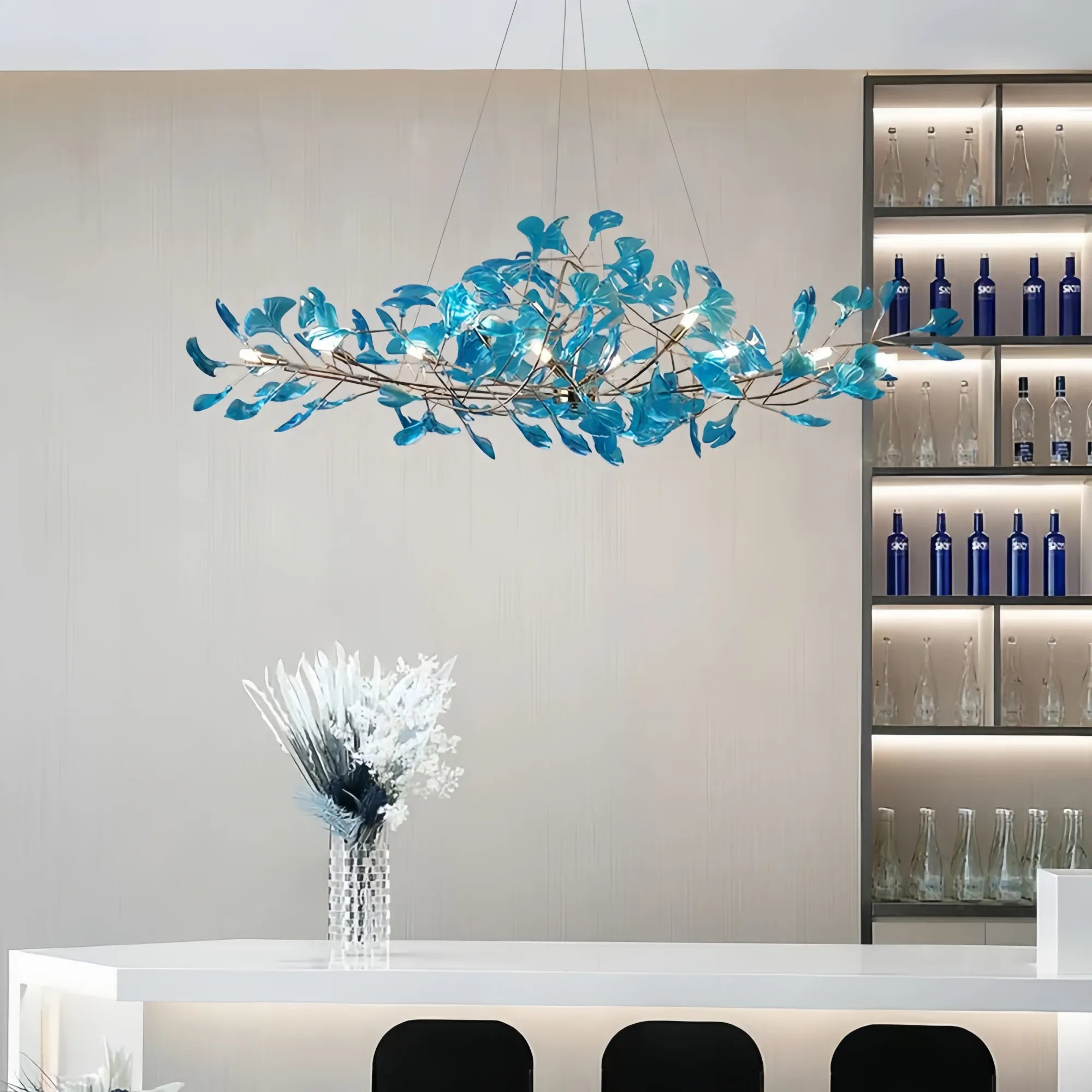 Blue glass ginkgo leaf chandelier in modern interior