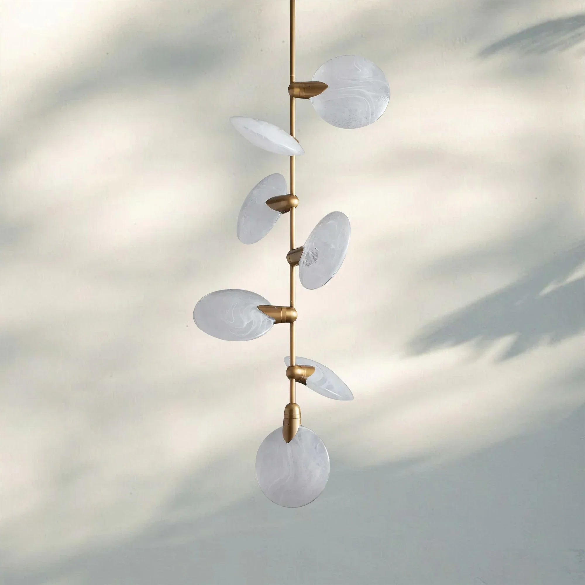 Lyla Pendant Light front view with alabaster shade and brass finish